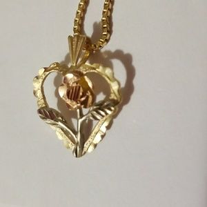 14k gold necklace with green/pink rose in heart